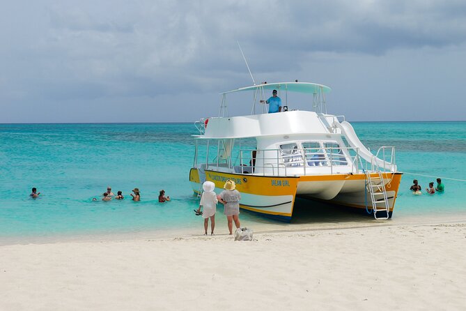Afternoon Half Day Cruise from Providenciales with Snorkeling and Iguana Island - Sliding and jumping into turquoise water