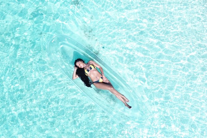 Clear Kayak Drone Photoshoot in Grand Turk, Turks and Caicos - Preparing your outfit and getting into the kayak