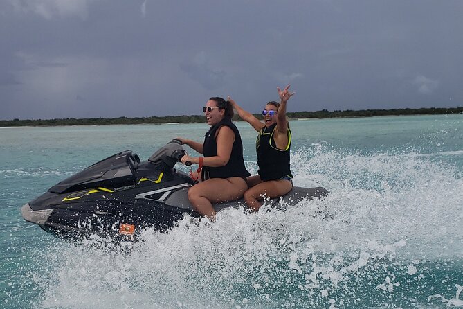 Jet Ski Shipwreck and Private Island Excursion - Riding across the clear Providenciales water