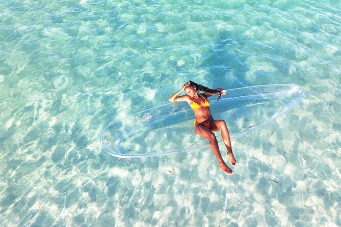 Providenciales Clear Kayak Shoots in Turks and Caicos Island - Posing while the drone hovers overhead